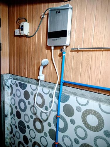 a device is hooked up to a wall at Mount Pulag SMR Homestay in Kabayan