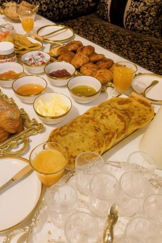 a table with bread and other foods on it at DAR moha Dades in Aït Ougliff