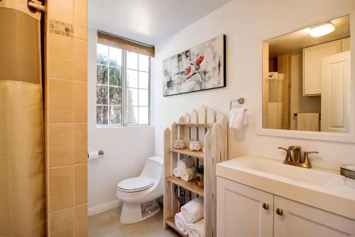 a bathroom with a sink and a toilet and a mirror at Wine Country Ranch Escape in Buellton