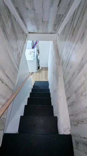 a staircase leading up to a room with at Luxury 2bedrooms 1bath home near philly museum Temple and center city in Philadelphia