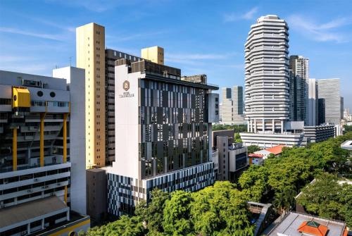 a view of a city skyline with tall buildings at Hotel Traveltine Downtown Singapore, Trademark Collection in Singapore