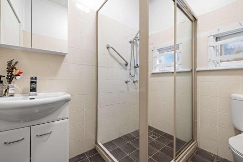 a bathroom with a shower and a sink at Boutique Double Room - Centrally Located at Granville - Shared Bathroom in Sydney