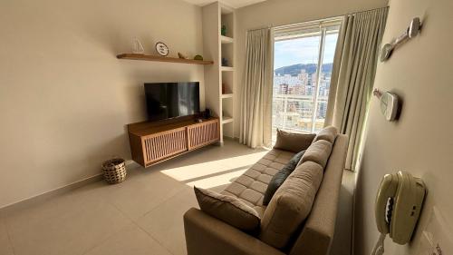 TV a/nebo společenská místnost v ubytování Book Santos Unlimited 1809 - Vista Mar & Piscina