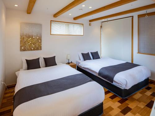 Postel nebo postele na pokoji v ubytování Cocoro Villa With Sauna