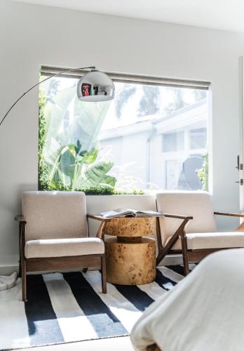 a room with two chairs and a table and a window at Simple La Jolla Epic bungalow #1 in San Diego