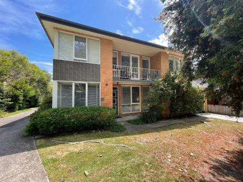 a large house with a yard in front of it at Prime location 3-bedder just moments from Central Park in Glen Iris