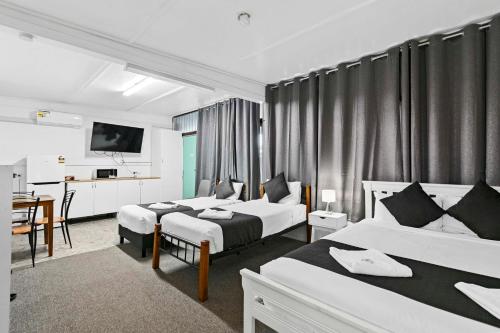 Postel nebo postele na pokoji v ubytování Maryborough City Motel