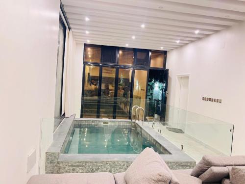 a swimming pool in the middle of a house at MY HOTEL Al Lathba Pool Villa - Nizwa فيلا اللثبه-نزوى in Nizwa