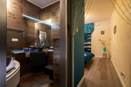 a bathroom with a tub and a sink and a toilet at PlatinumTowers! PRIVAT JACCUZI! PANORAMIC CITY VIEW from 14 Floor! LOGGIA! PARKING! 66m2! 2 ROOMS in Warsaw