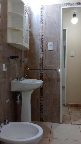 a bathroom with a sink and a shower at Casa la hermosura de Mayú in San Antonio de Arredondo