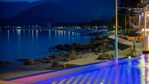 a view of a body of water at night at Namhae Melody Kids Private Pension in Sukho
