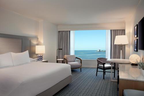 a hotel room with a bed and a large window at Grand Hyatt Tampa Bay in Tampa