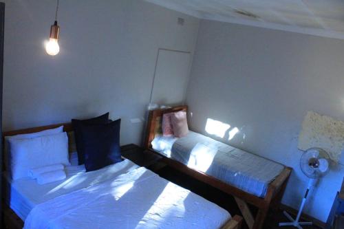 a bedroom with two beds in a room at Thullyteams guesthouse in Tzaneen
