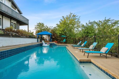a swimming pool with blue chairs and a gazebo at Entire Private Pool, Big Yard, View, 4BR, King Bed, 10 Parking, Available Now in El Cajon