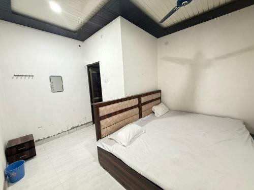 a bedroom with a bed in a room at Hotel O stay inn in Shivāpur