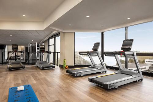 a gym with treadmills and elliptical machines at Radisson Blu Vancouver Airport Hotel & Marina in Richmond
