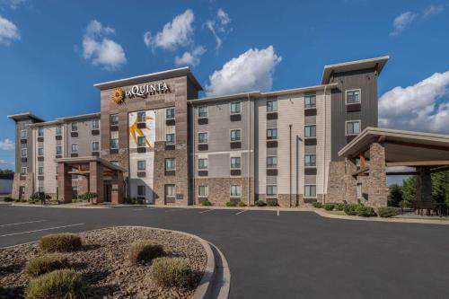 a rendering of a hotel with a parking lot at La Quinta Inn & Suites by Wyndham Greenville Woodruff Rd in Greenville