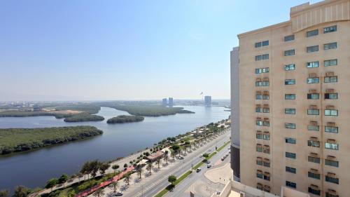 a view of a river from a building at Sunday Mangrove Corniche Hotel, Ras Al Khaimah in Ras al Khaimah