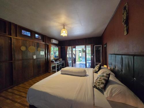 a bedroom with two beds in a room at Amban Beach House in Manokwari