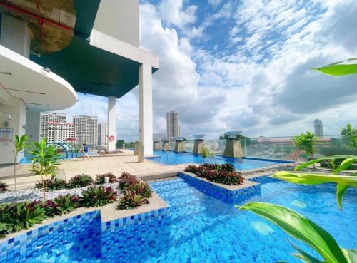 a swimming pool on the roof of a building at GYDEN STAYCATION #Straits Suites & Residences in Johor Bahru