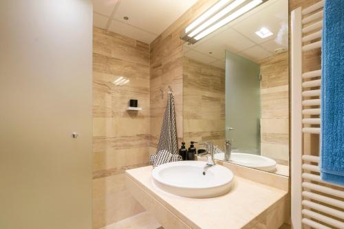 a bathroom with a sink and a mirror at INMalaga Luxury Penthouse Nueva 3 in Málaga
