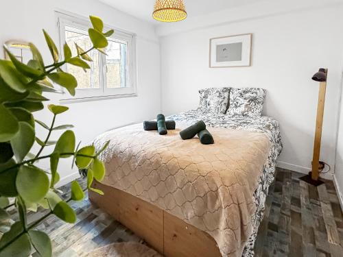 Ένα ή περισσότερα κρεβάτια σε δωμάτιο στο Douce parenthèse pour deux à Bourges