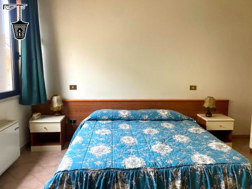 Ένα ή περισσότερα κρεβάτια σε δωμάτιο στο Hotel La Lanterna