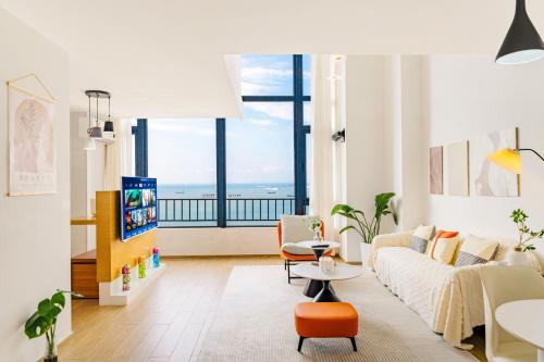 Ένα ή περισσότερα κρεβάτια σε δωμάτιο στο Dreamscape villa xiaozhu loft apartment 100 meters to the beach