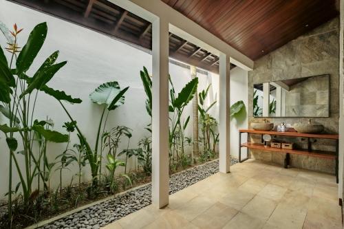 a room with plants on the wall at Oceanfront Luxury Villa in Beraban with Private Pool in Krambitan