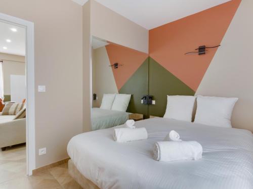 Ένα ή περισσότερα κρεβάτια σε δωμάτιο στο En Centre ville Gare et commerces