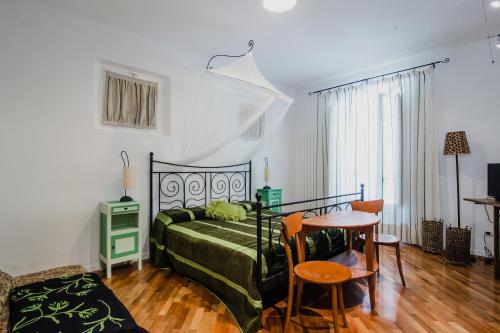 A bed or beds in a room at Agriturismo Le Vigne del Conero