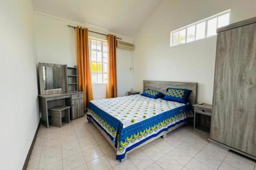 Ένα ή περισσότερα κρεβάτια σε δωμάτιο στο Koala West Coast Escape