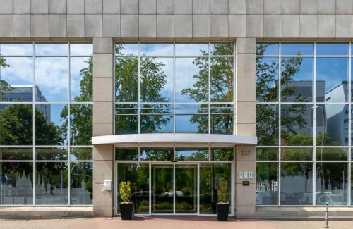 an external view of a building with large windows at NYX Hotel Erfurt by Leonardo Hotels in Erfurt
