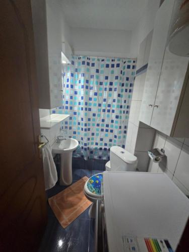 a small bathroom with a toilet and a sink at GiannisHouse in Florina