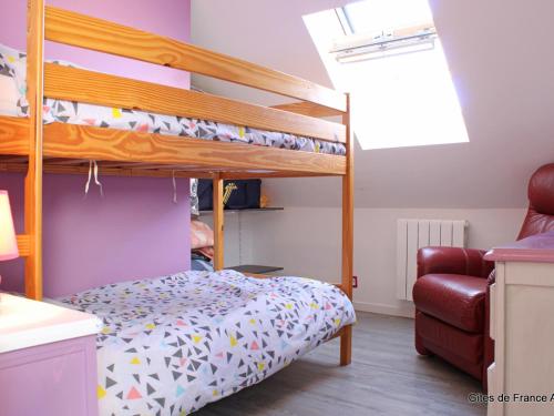 a bedroom with two bunk beds and a chair at Longère rénovée avec piscine privée, Wi-Fi et climatisation - FR-1-489-201 in Échassières