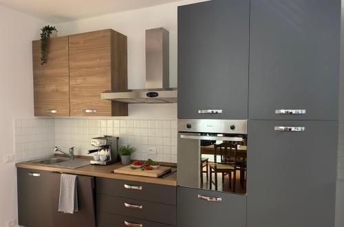 a kitchen with a stove top oven and a table at Tenuta Vinci in Capannori