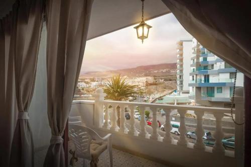 a balcony with a view of a city at Playa Paraiso Seaview in Adeje