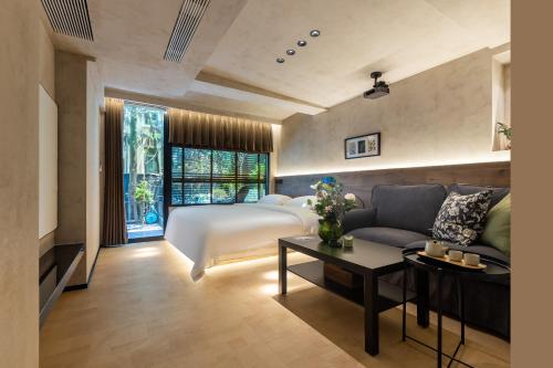 Ένα ή περισσότερα κρεβάτια σε δωμάτιο στο Heidi Garden Homestay