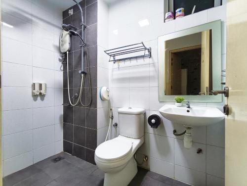 a bathroom with a toilet and a sink at AZ 3Rooms Apartment at De Centrum Bangi-Putrajaya in Kajang
