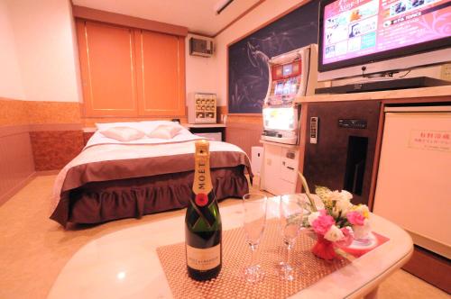 a hospital room with a bottle of wine on a table at STAR RESORT Will in Morioka