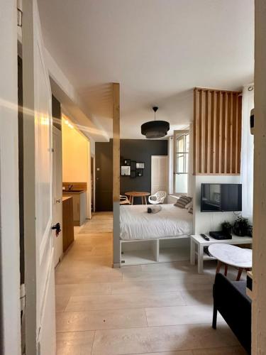 Una cama o camas en una habitación de Le Repos du Tertre