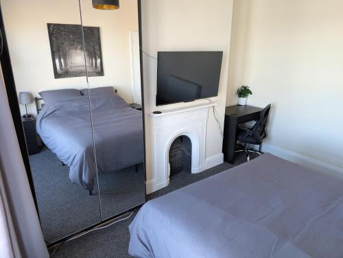 Ένα ή περισσότερα κρεβάτια σε δωμάτιο στο CosyRooms Central Bristol