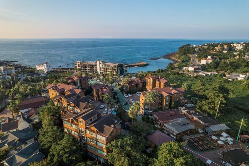 an aerial view of a city with the ocean at Dyne Resort in Jeju