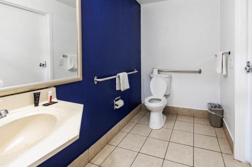 a bathroom with a sink and a toilet at Budget Inn Greenville By Hotel O I-85 in Greenville