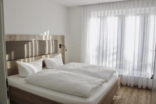 Una cama o camas en una habitación de WeberHof Appartements