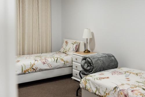 Katil atau katil-katil dalam bilik di Tuckeroo Cottages - Tuckeroo House