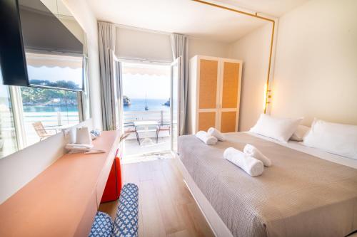 Ένα ή περισσότερα κρεβάτια σε δωμάτιο στο Bianco Resort