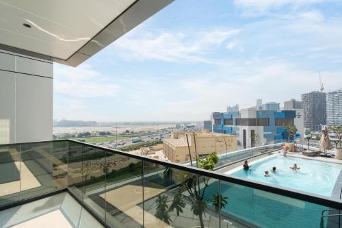 a swimming pool on the roof of a building at Samaya Holiday Homes - Nobles Family Modern Suites in Dubai