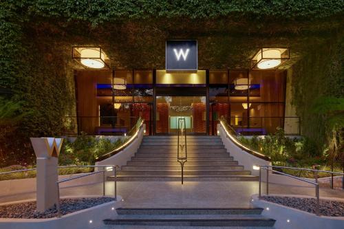 a staircase leading to a building with a sign on it at W Los Angeles – West Beverly Hills in Los Angeles