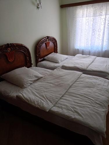 Katil atau katil-katil dalam bilik di Guest House rent, дом в аренду